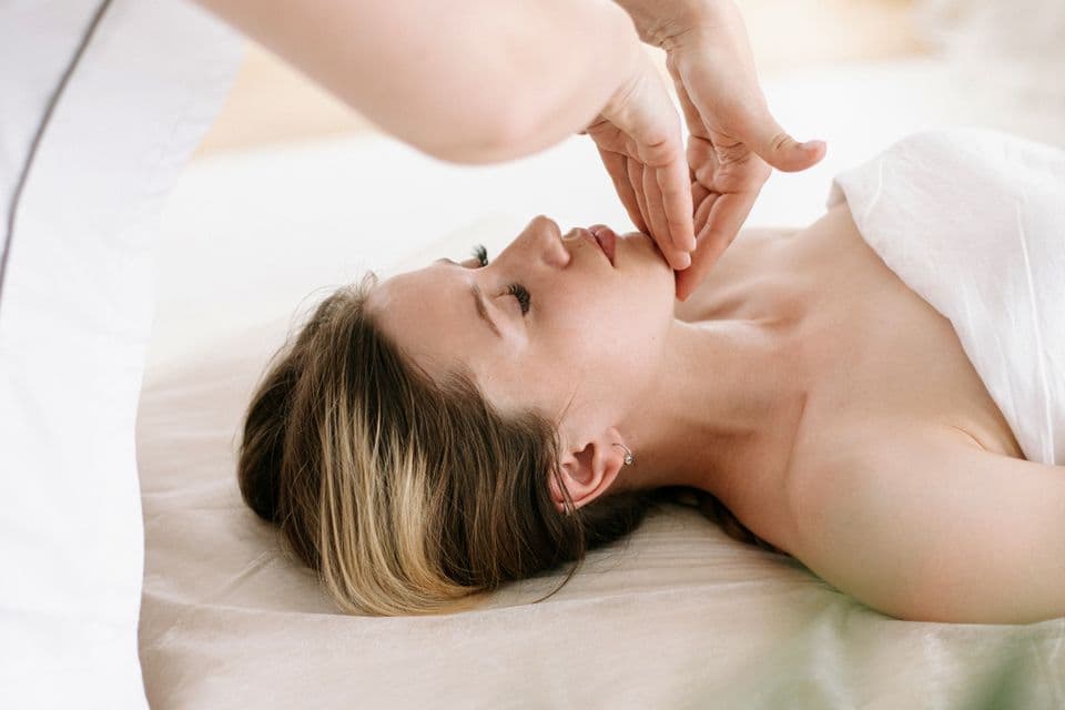 Facial massage treatment at a spa using natural oils
